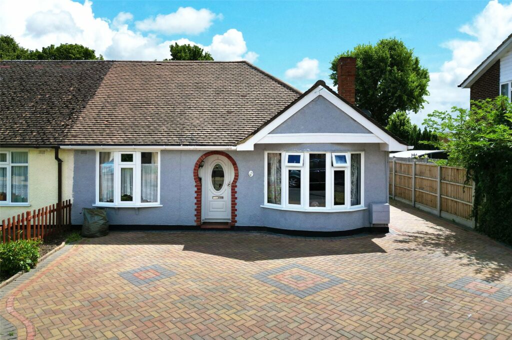 Two bedroom semi detached extended bungalow with driveway and garage