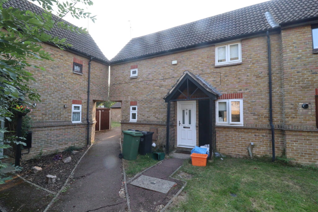 Two bedroom terraced house with garage offered on the 50% shared ownership scheme.